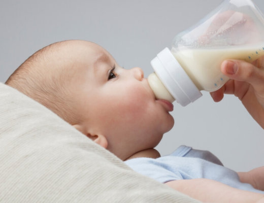 baby drinking bottle of milk
